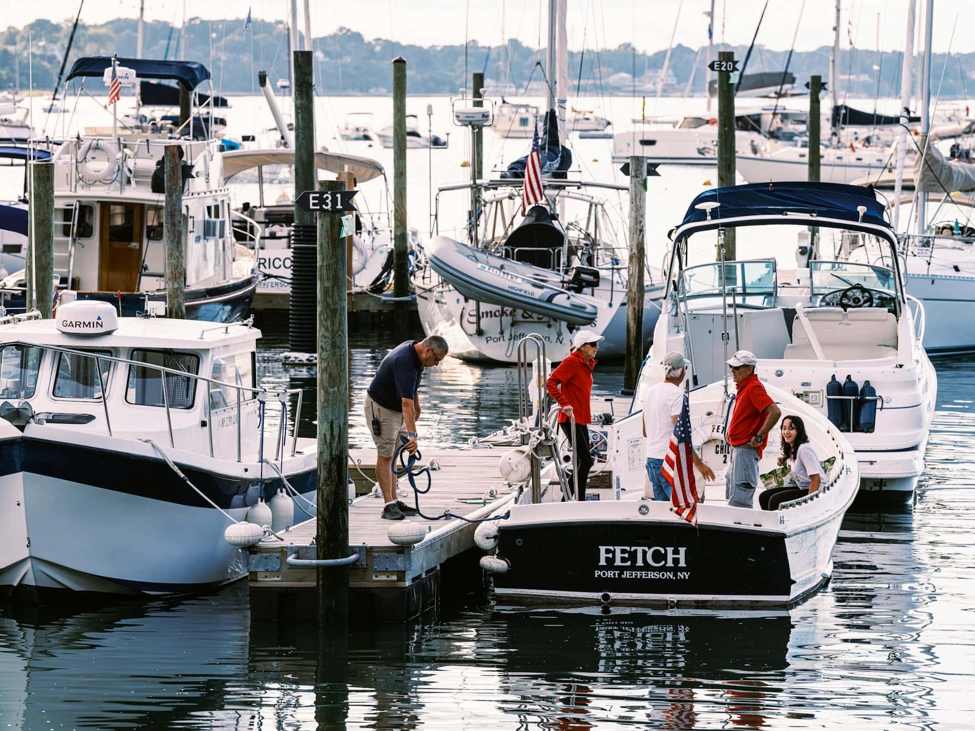Boater and marina team coordinating dockside workflow