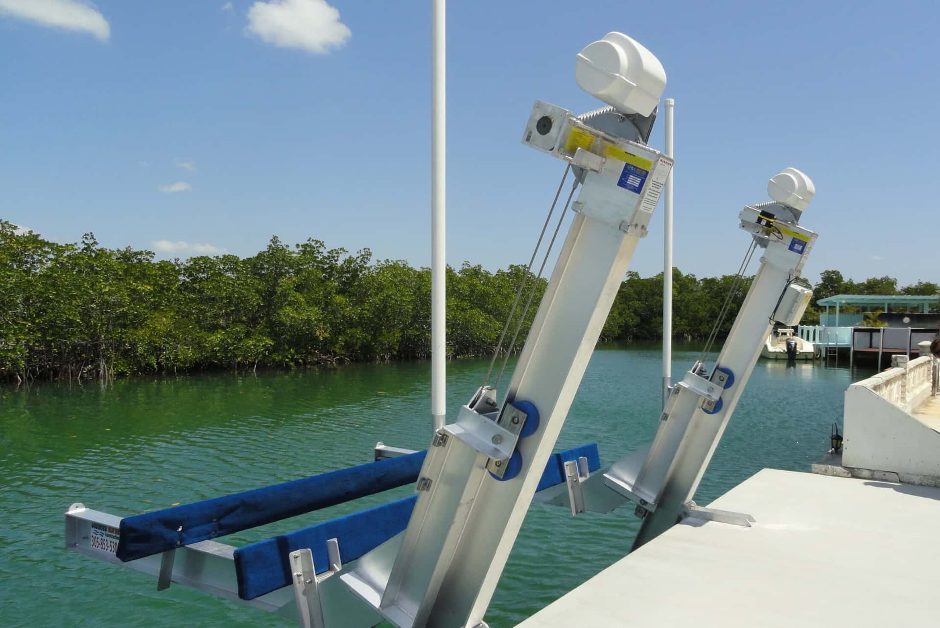 Smart boat lift on a dock connected to Atlantis Marina