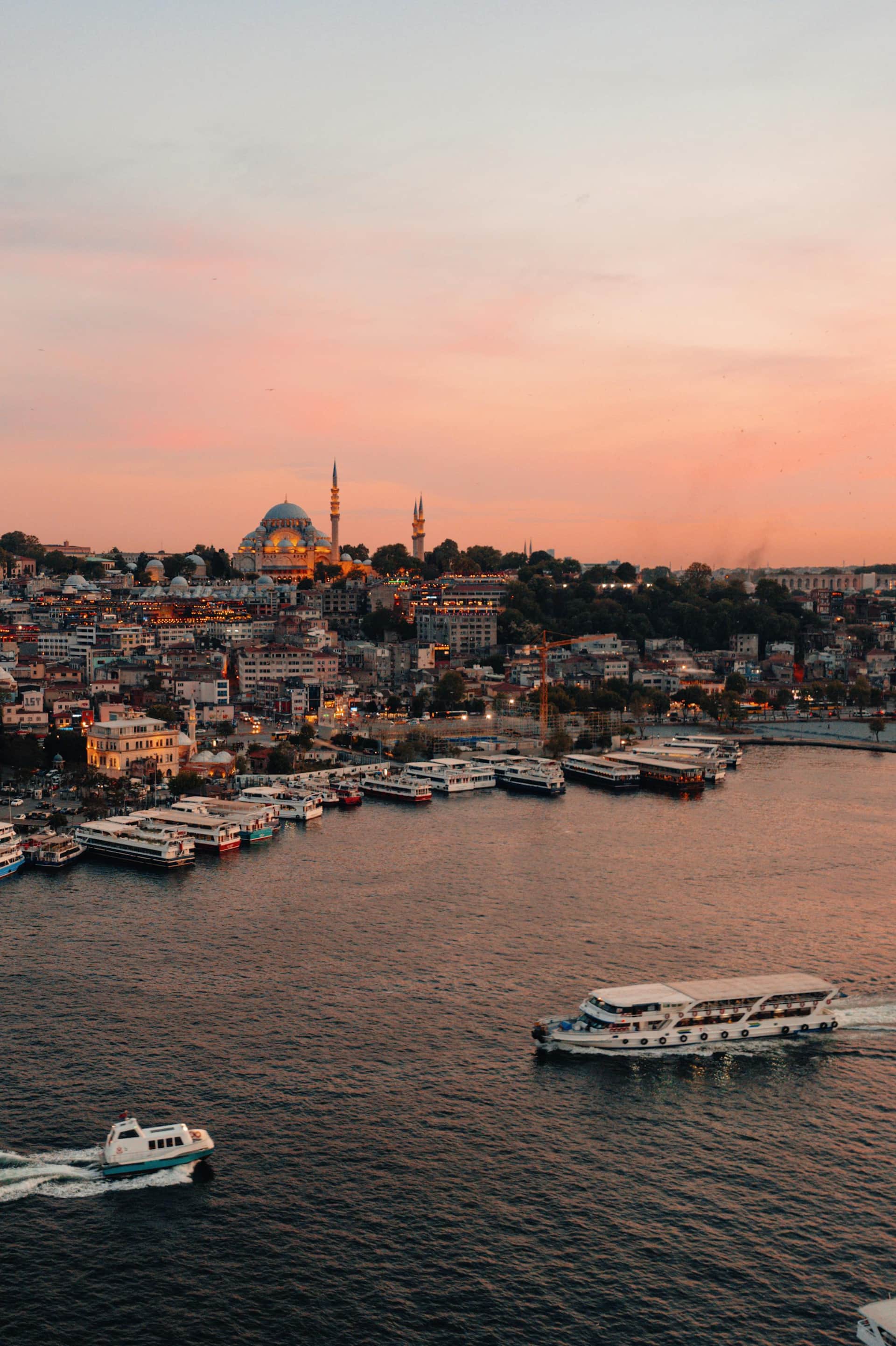 Aerial waterfront city and marina at sunset