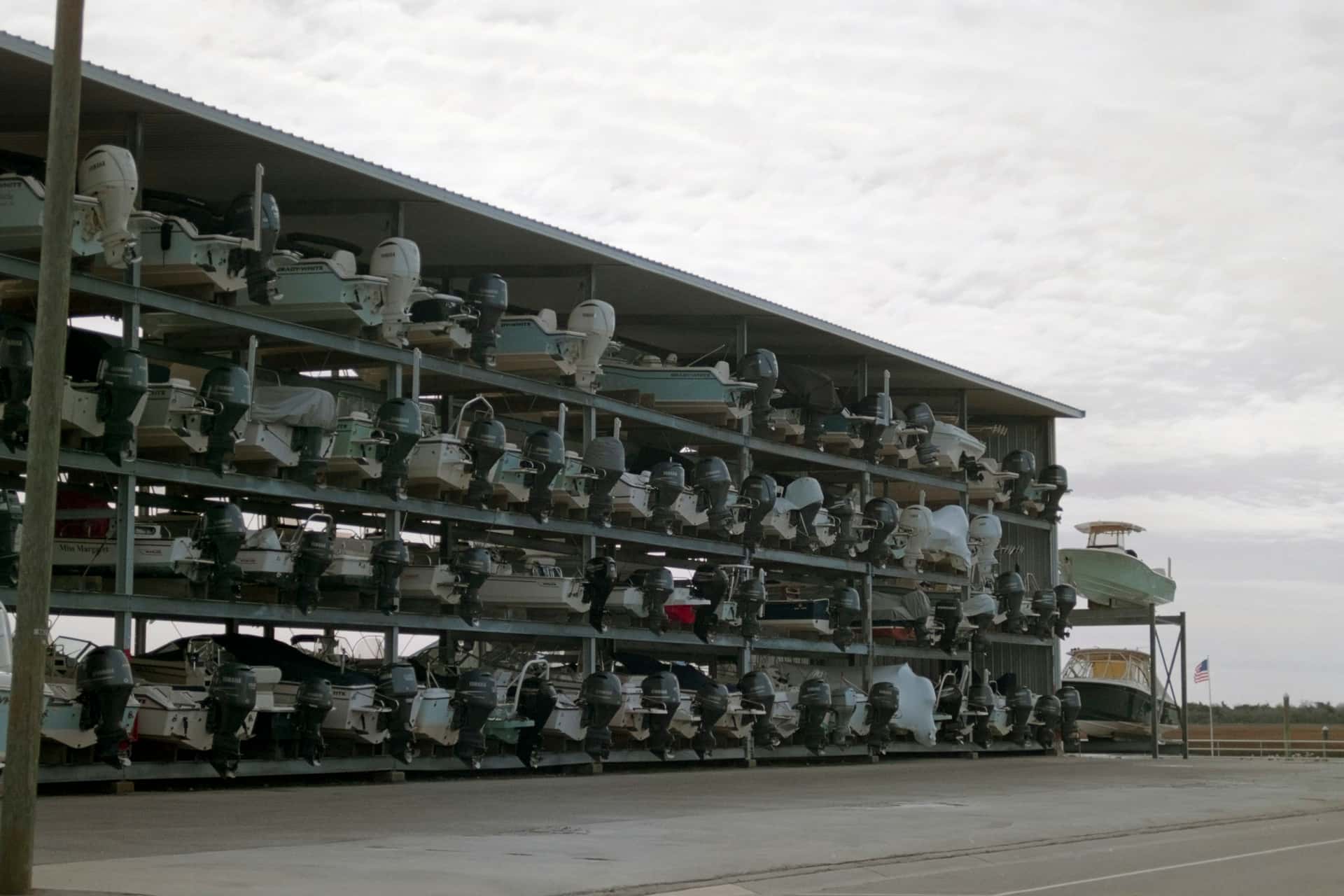 Boats stored in multi-level dry stack marina racks