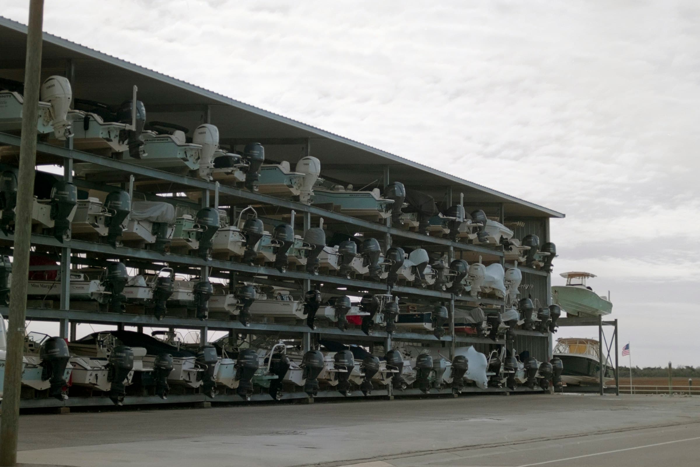 Boats stored in multi-level dry stack marina racks