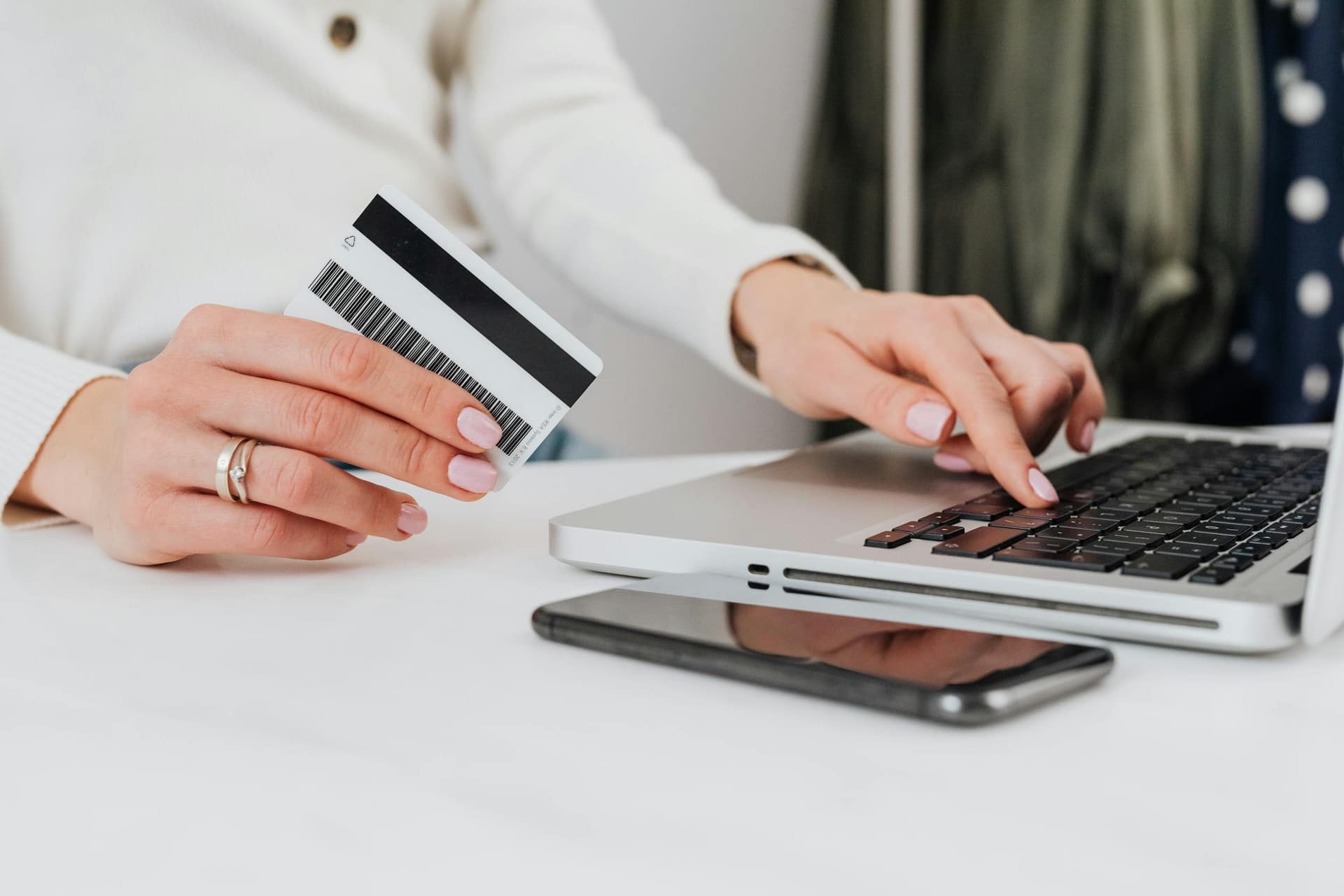 Customer entering a card payment on a laptop