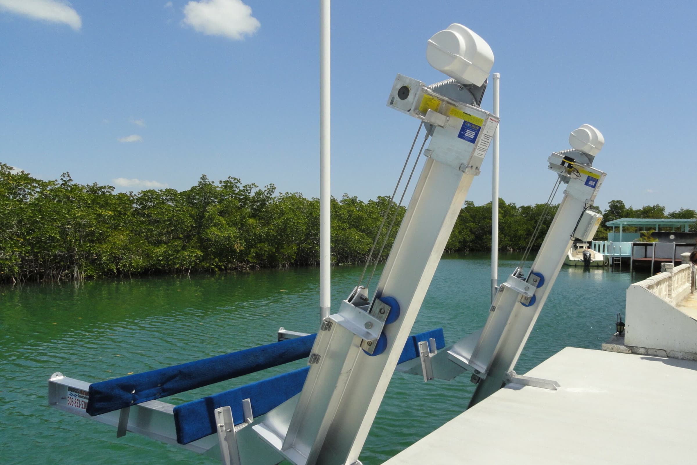 Smart boat lift on a dock connected to Atlantis Marina