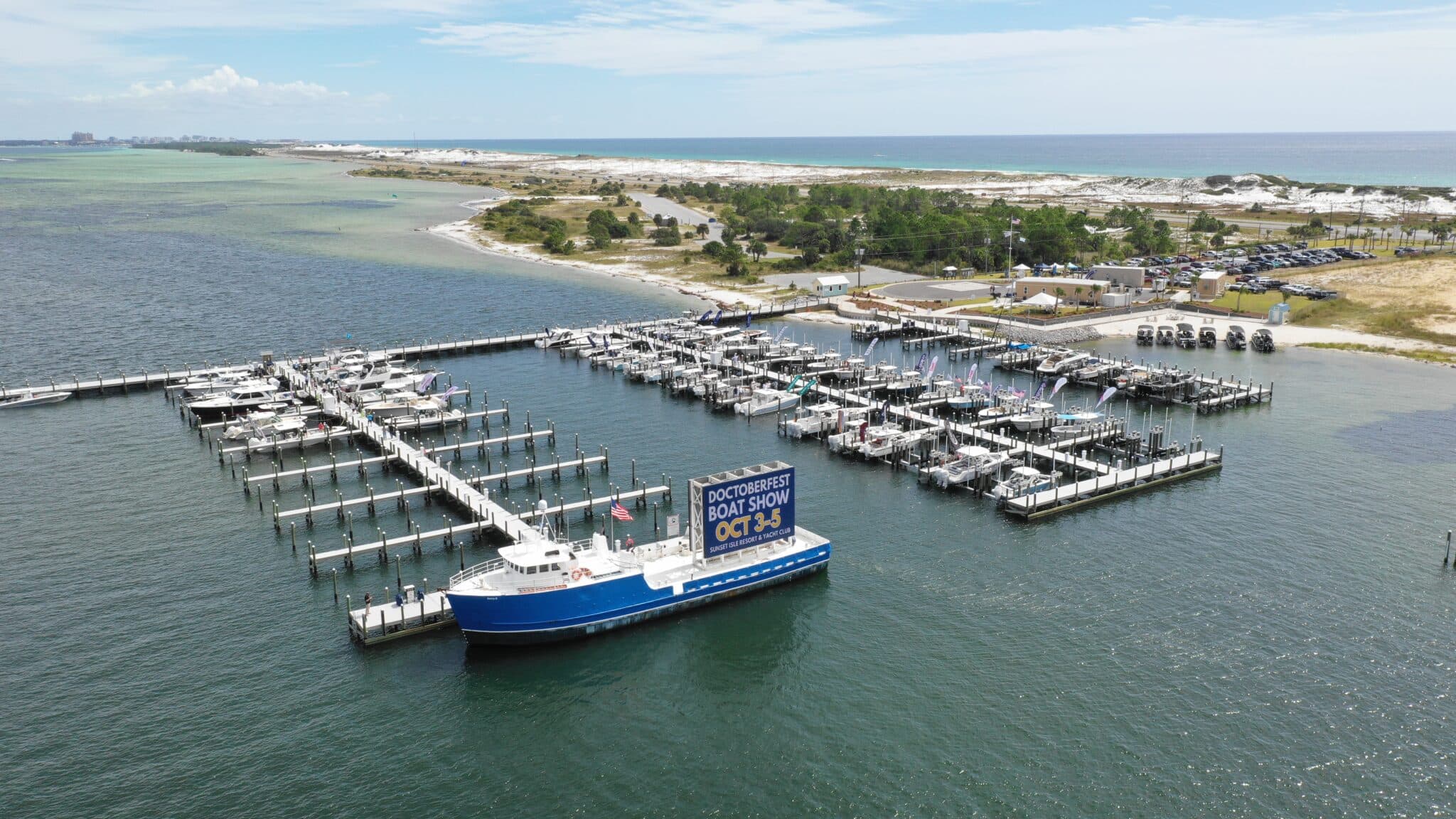 Daytime aerial view of Sunset Isle Yacht Club marina slips in Fort Walton Beach