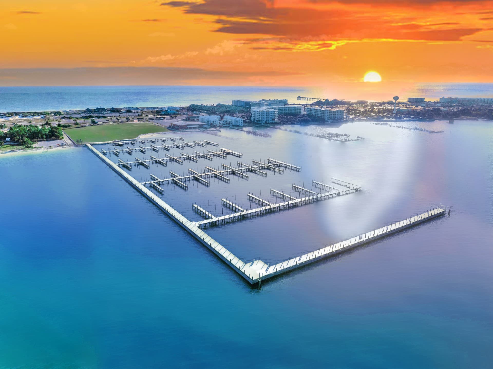 Sunset aerial view over Sunset Isle Yacht Club and Fort Walton Beach